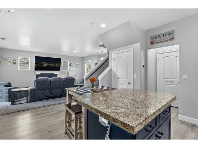 a kitchen that has a table and chairs in it
