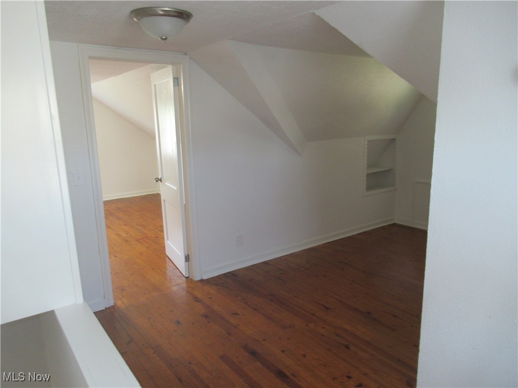 1397 Sunset Road Cleveland, OH 44124 - Photo 20 of 32 Bonus room featuring hardwood / wood-style flooring, lofted ceiling, and baseboards