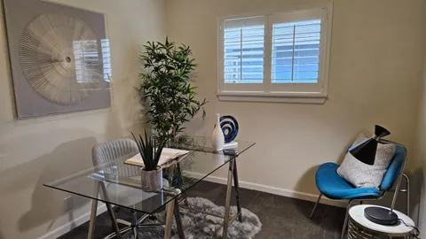 a view of a room with furniture and a potted plant
