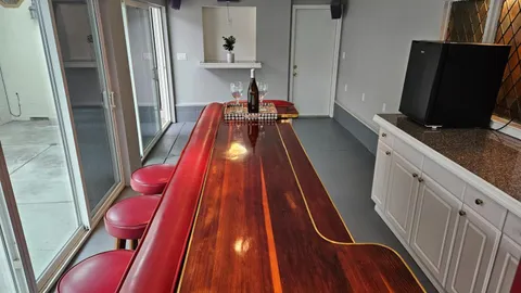 a room with wooden floor and furniture