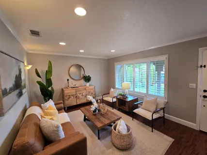 a living room with furniture and a window