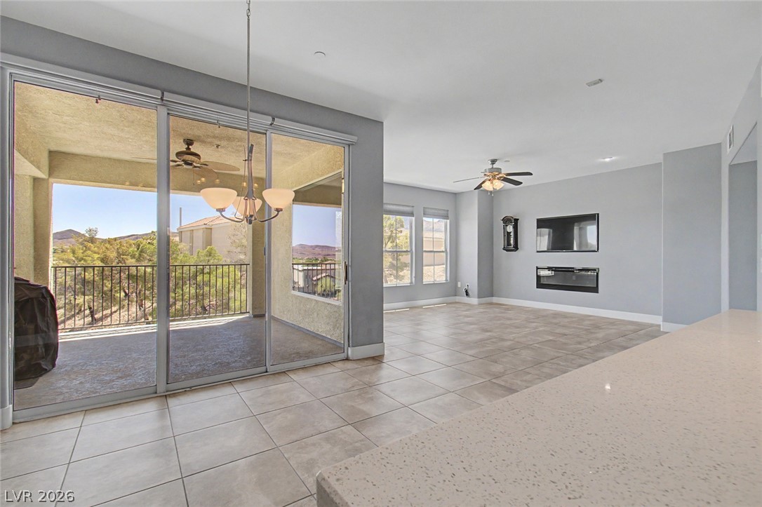 2555 Hampton Road, Unit 6308 Henderson, NV 89052 - Photo 17 of 30 This kitchen view offers seamless access to the living space & to a spacious balcony offering picturesque hillside views.