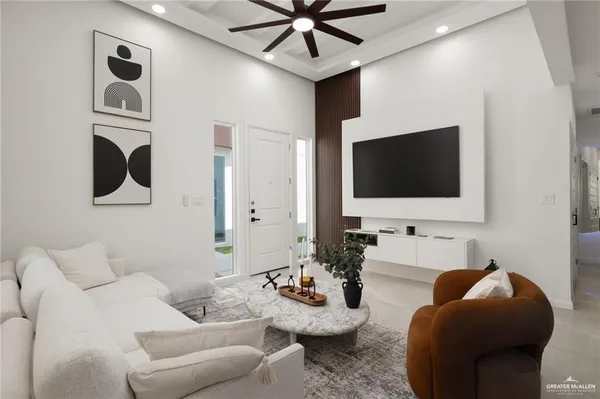 a living room with furniture and a flat screen tv