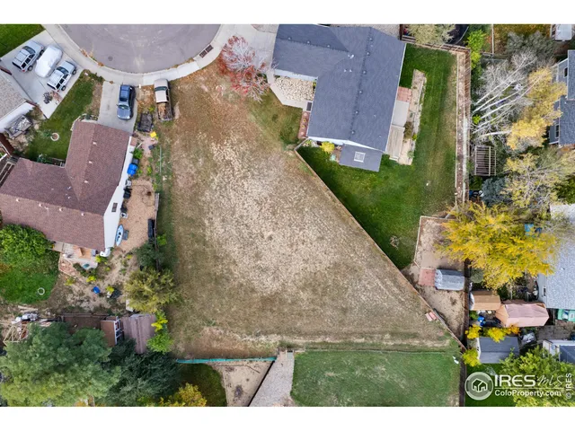 a view of a house with a yard and garden
