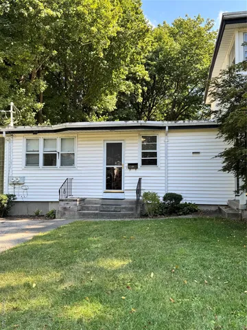 a view front of house with backyard and outdoor seating