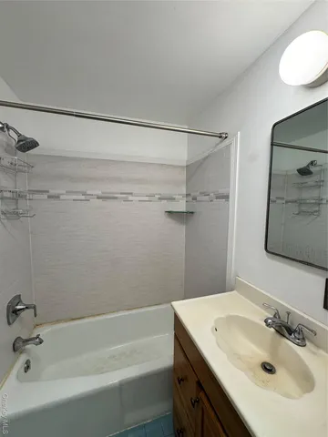a utility room with multiple dryer and washer
