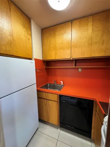 a view of an empty room with a fireplace