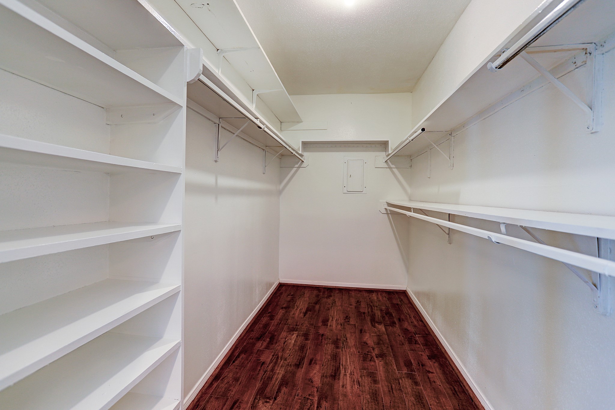1201 McDuffie Street, Unit 207 Houston, TX 77019 - Photo 12 of 13 a view of walk in closet with wooden floor
