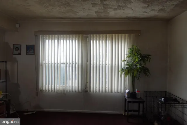 a kitchen with a refrigerator and cabinets
