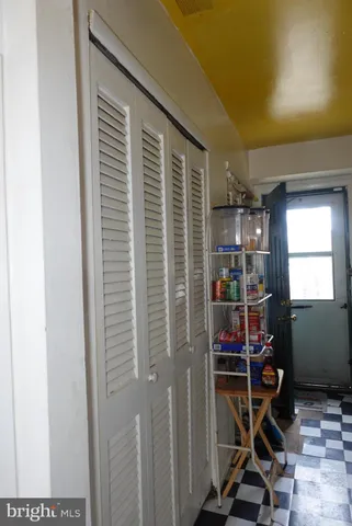 a view of living room with furniture and a window