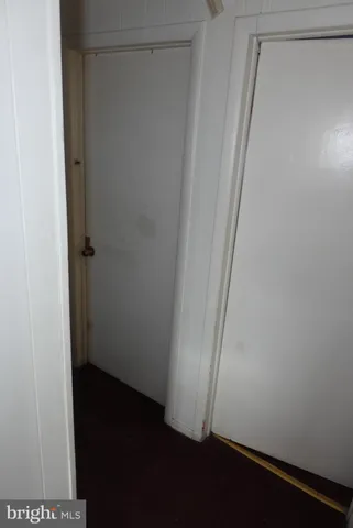 a bathroom with a sink toilet and a mirror