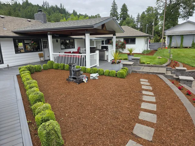 a front view of a house with garden