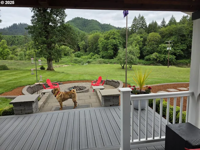 a view of a deck with wooden floor and outdoor seating
