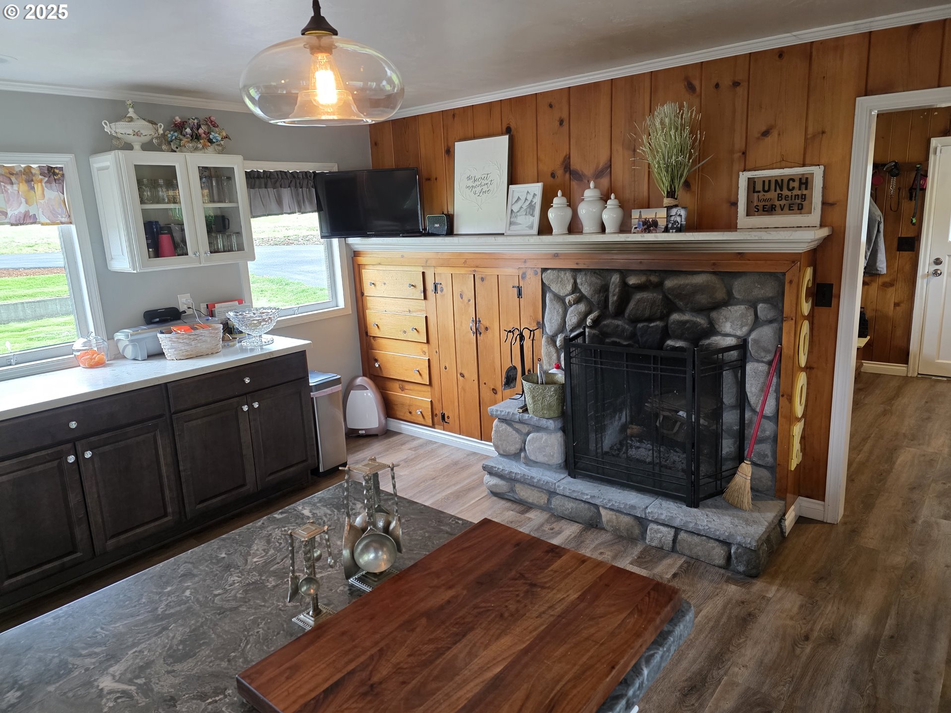 4340 Highway 38 Drain, OR 97435 - Photo 3 of 22 a living room with furniture a fireplace and kitchen view