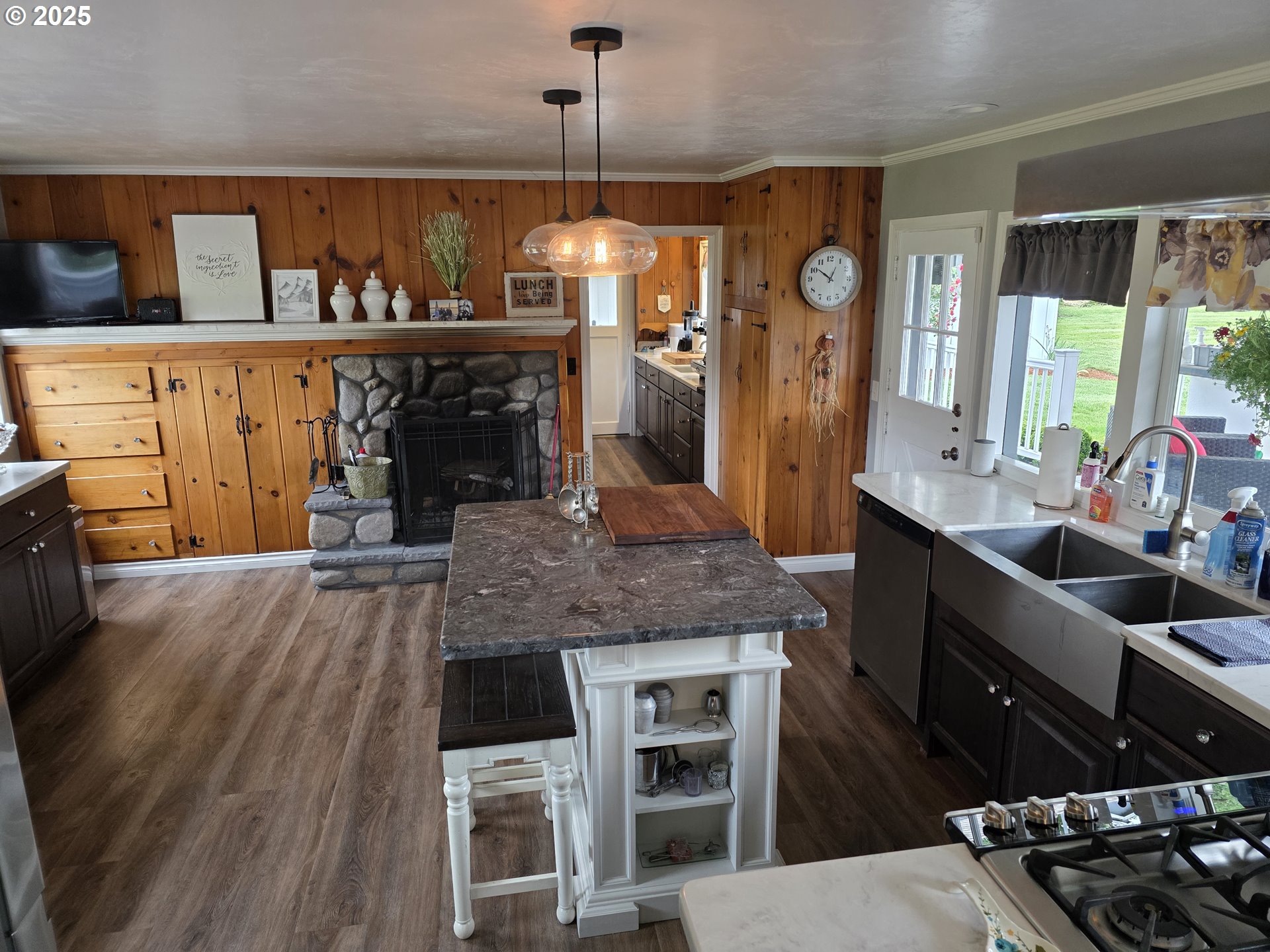4340 Highway 38 Drain, OR 97435 - Photo 5 of 22 a kitchen with stainless steel appliances granite countertop a stove a refrigerator a sink a dining table and chairs with wooden floor