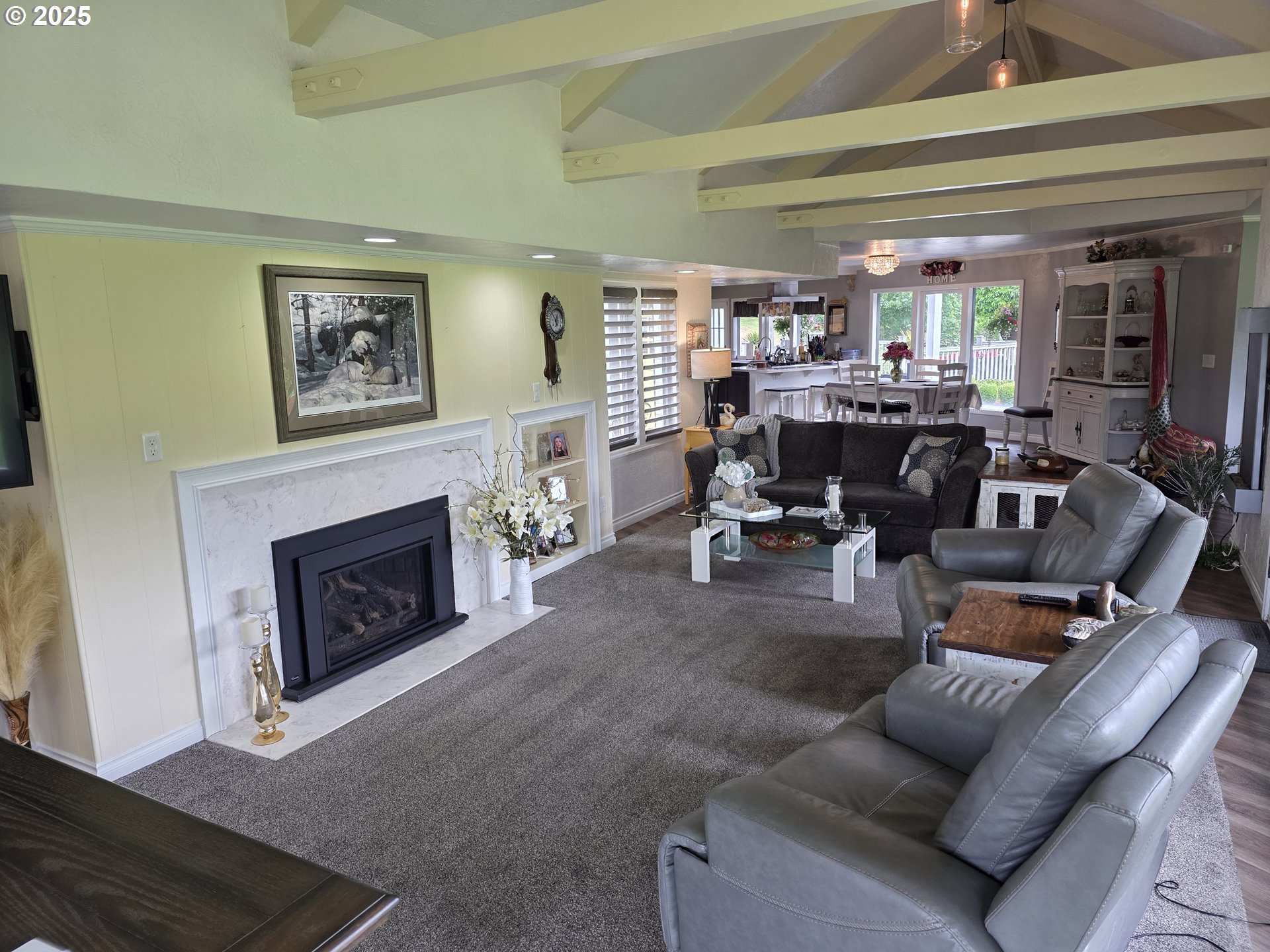 4340 Highway 38 Drain, OR 97435 - Photo 8 of 22 a living room with furniture a fireplace and a large window