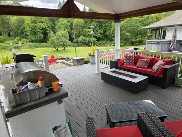 a living room with furniture and a garden