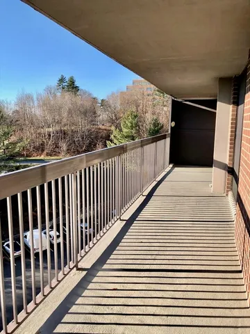 a view of balcony with furniture