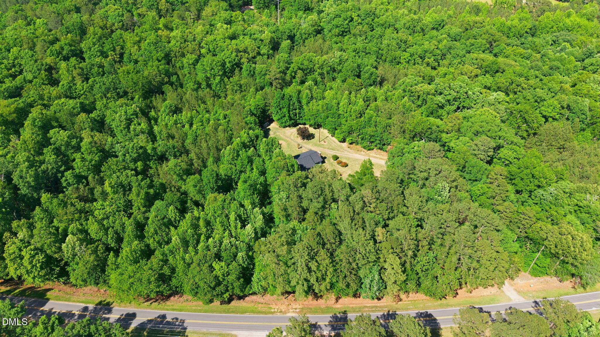 3602 Harrison Road Castalia, NC 27816 - Photo 21 of 48 a backyard of a house with lots of green space