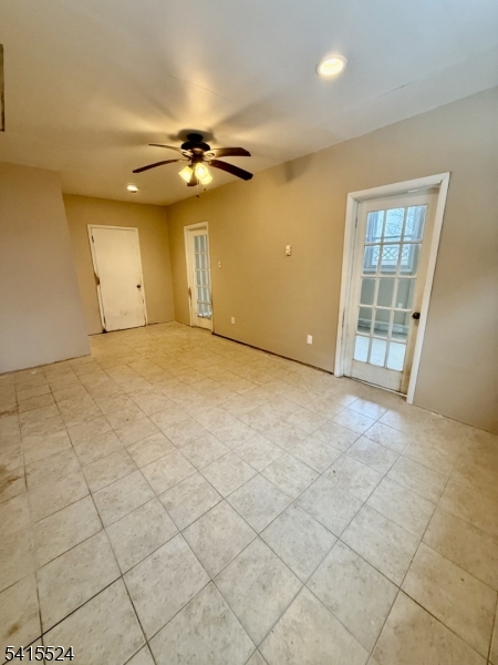 150 Karrville Road Port Murray, NJ 07865 - Photo 22 of 40 an empty room with windows and ceiling fan