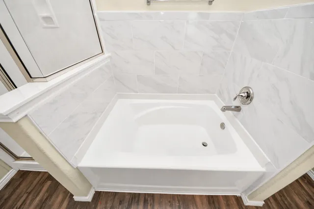 a bathroom with a white bath tub