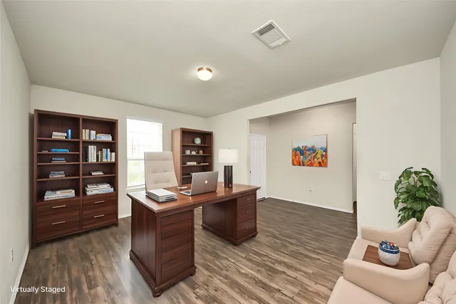 a workspace with furniture and window