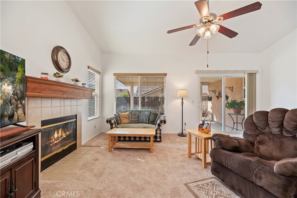 2664 Hazy Way Banning, CA 92220 - Photo 14 of 56 a living room with furniture and a fireplace
