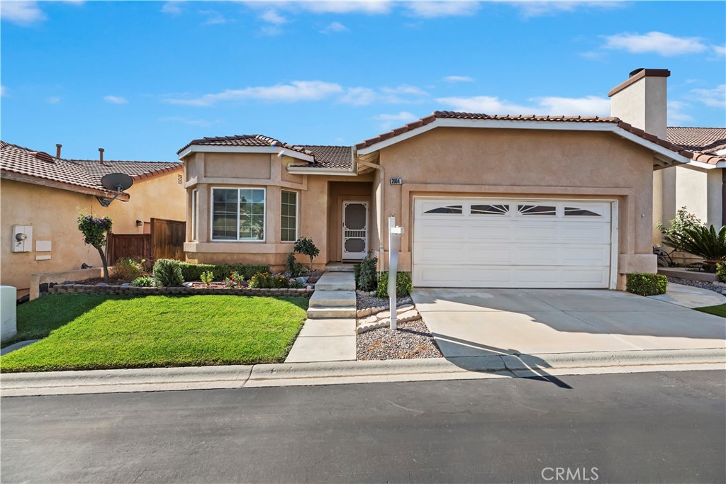 2664 Hazy Way Banning, CA 92220 - Photo 2 of 56 a front view of a house with a yard and garage