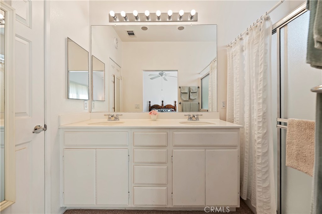 2664 Hazy Way Banning, CA 92220 - Photo 23 of 56 a bathroom with a double vanity sink mirror and