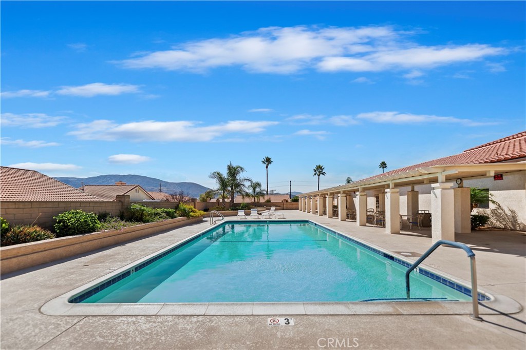 2664 Hazy Way Banning, CA 92220 - Photo 39 of 56 a view of a swimming pool with a lounge chair