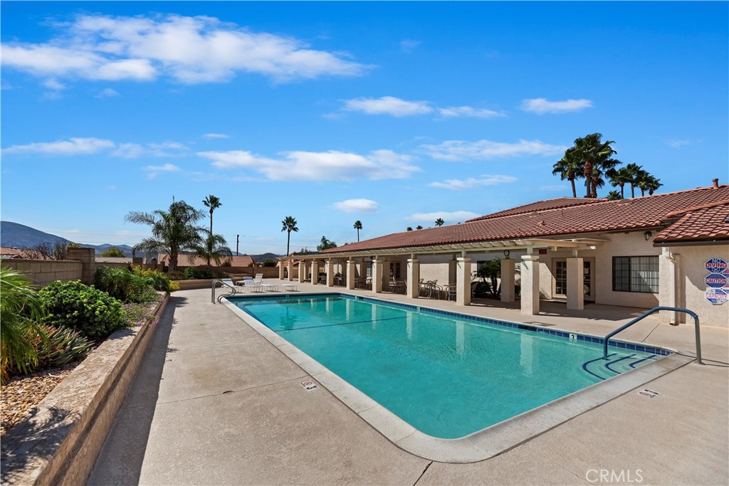 2664 Hazy Way Banning, CA 92220 - Photo 40 of 56 a view of a white house with a yard and potted plants