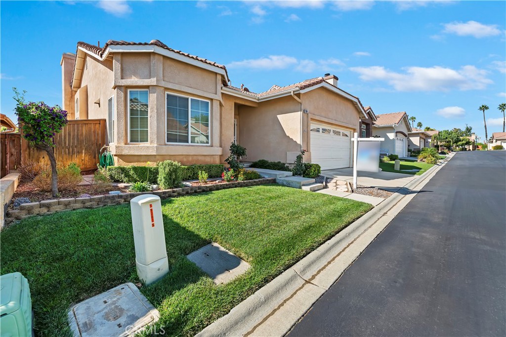 2664 Hazy Way Banning, CA 92220 - Photo 4 of 56 a front view of a house with garden