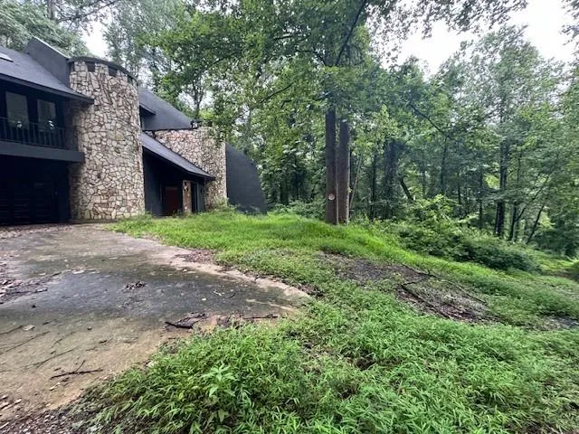a brick building with a yard