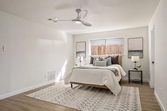 a bed room with a bed and a lamp