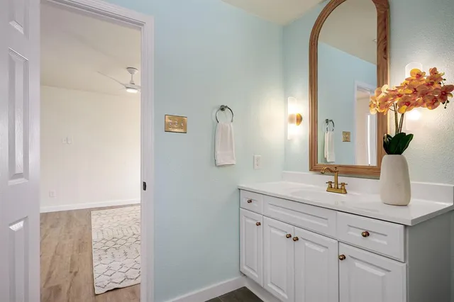 a bathroom with a sink and a mirror