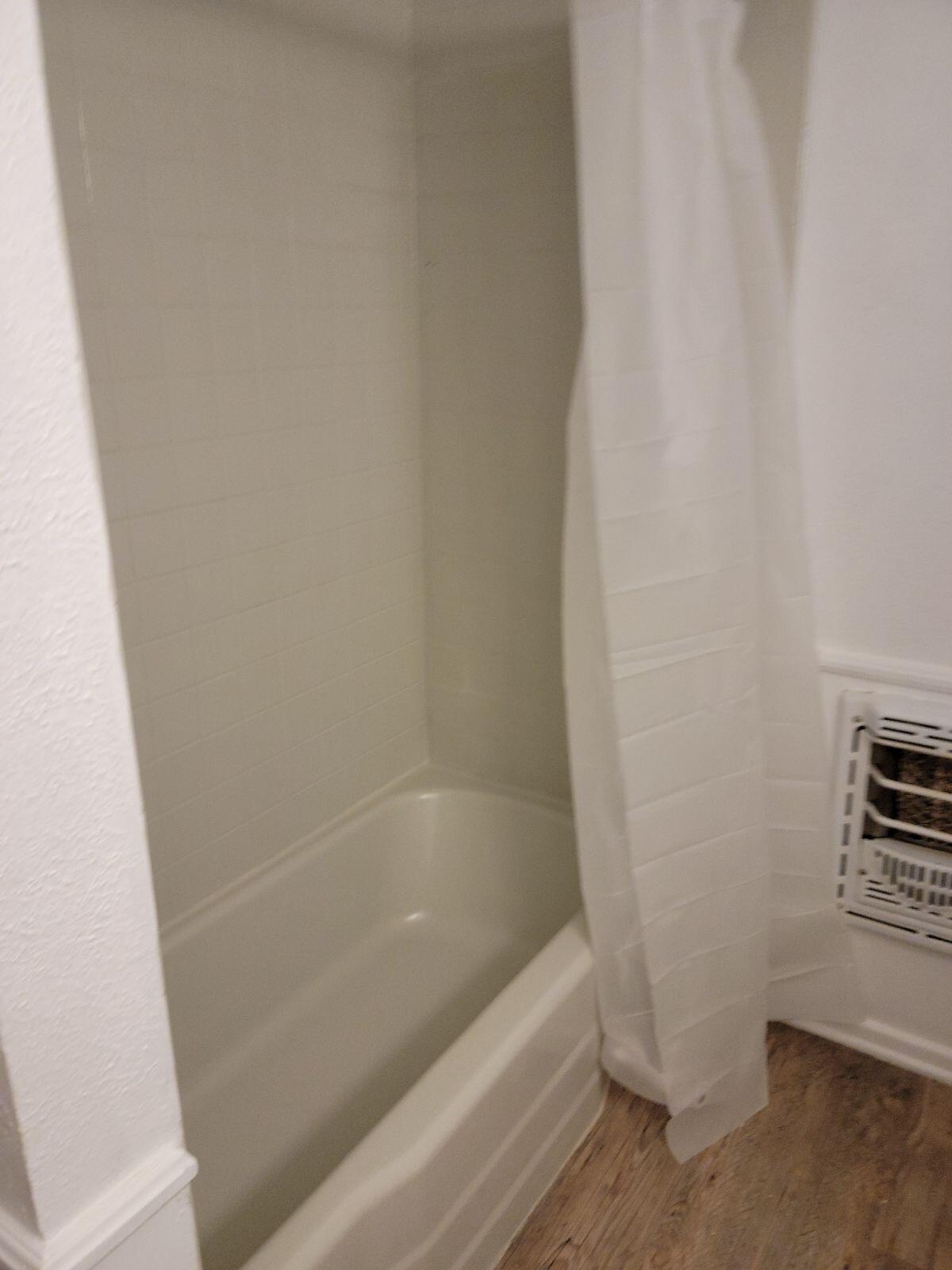 4412 29th Street Lubbock, TX 79410 - Photo 5 of 7 a bathroom with a bathtub