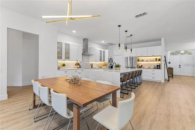 a view of a workspace with furniture and a bedroom