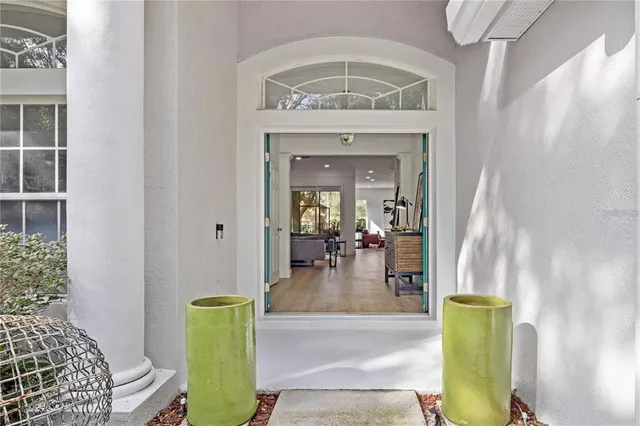 a view of living room with a table and chairs