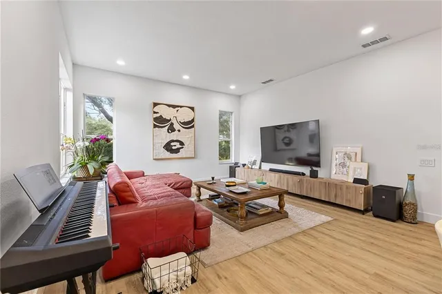 a bathroom with a sink mirror and vanity
