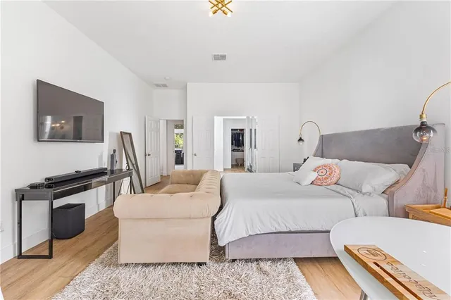 a kitchen with a refrigerator and a stove top oven