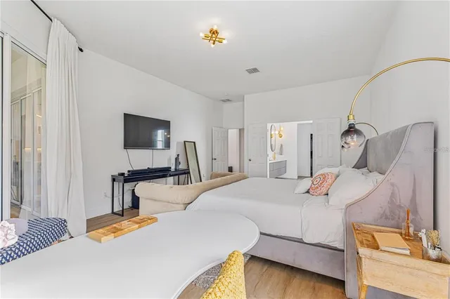 a view of a room with wooden floor and stairs