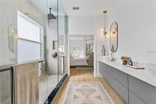 a bathroom with a toilet sink and shower