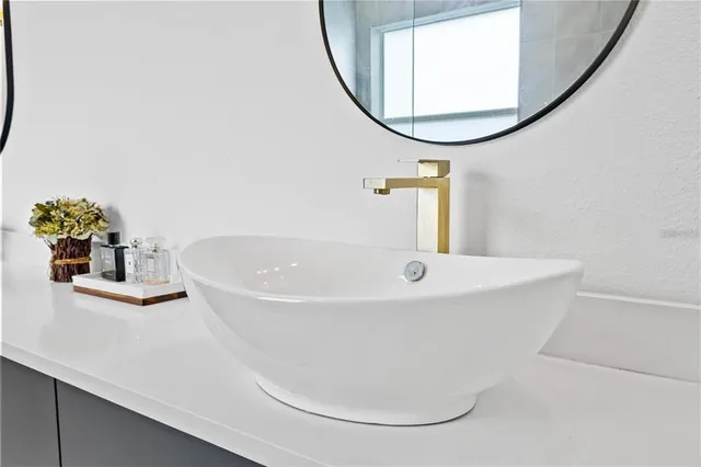 a bedroom with a bed and a table