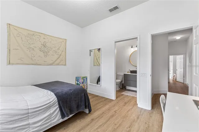 an aerial view of a house with a yard and garden