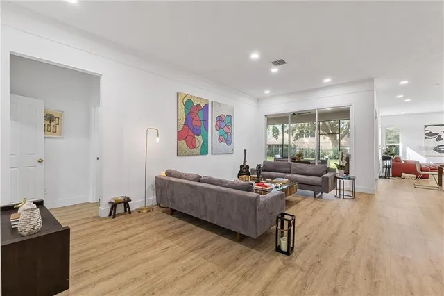 a large kitchen with lots of counter space and stainless steel appliances