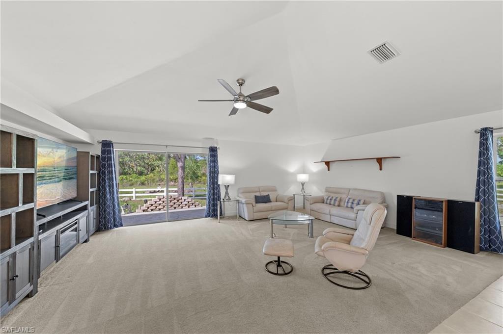 13541 Stringfellow Road Bokeelia, FL 33922 - Photo 7 of 49 a living room with furniture and a window