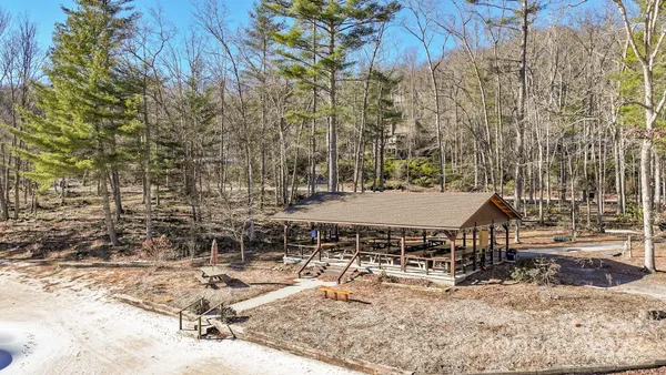 a view of a lake in between two chairs
