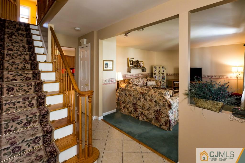 104 South Cliff Road Colonia, NJ 07067 - Photo 2 of 25 a view of living room kitchen and entryway