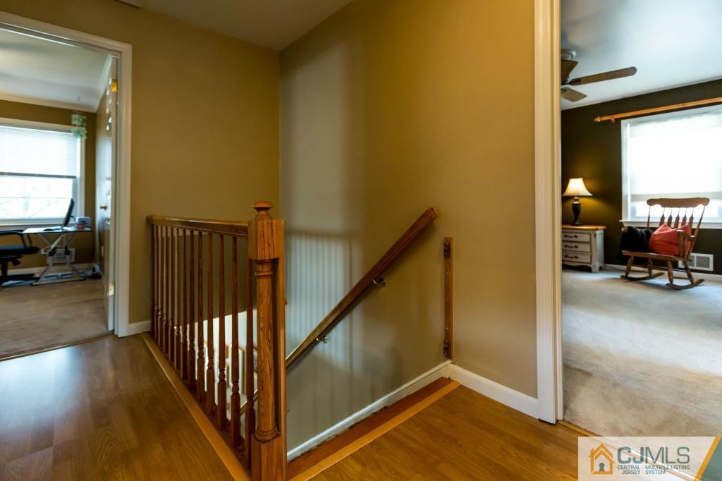 104 South Cliff Road Colonia, NJ 07067 - Photo 13 of 25 a view of a livingroom with furniture and stairs
