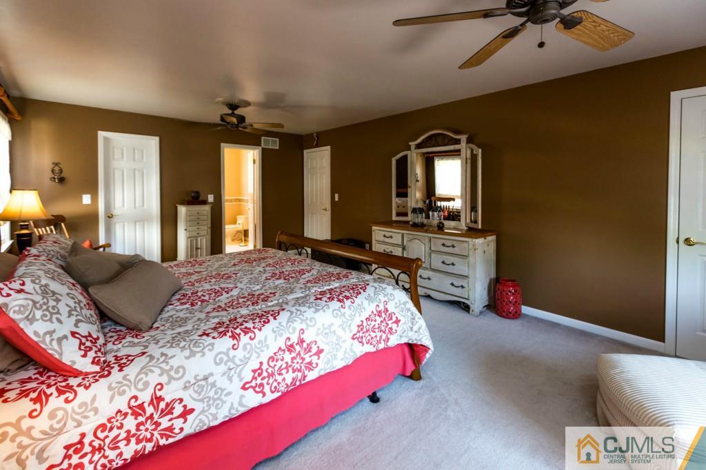 104 South Cliff Road Colonia, NJ 07067 - Photo 15 of 25 a bedroom with a bed window and dresser